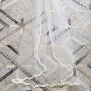 Handmade fingertip length lace trim veil